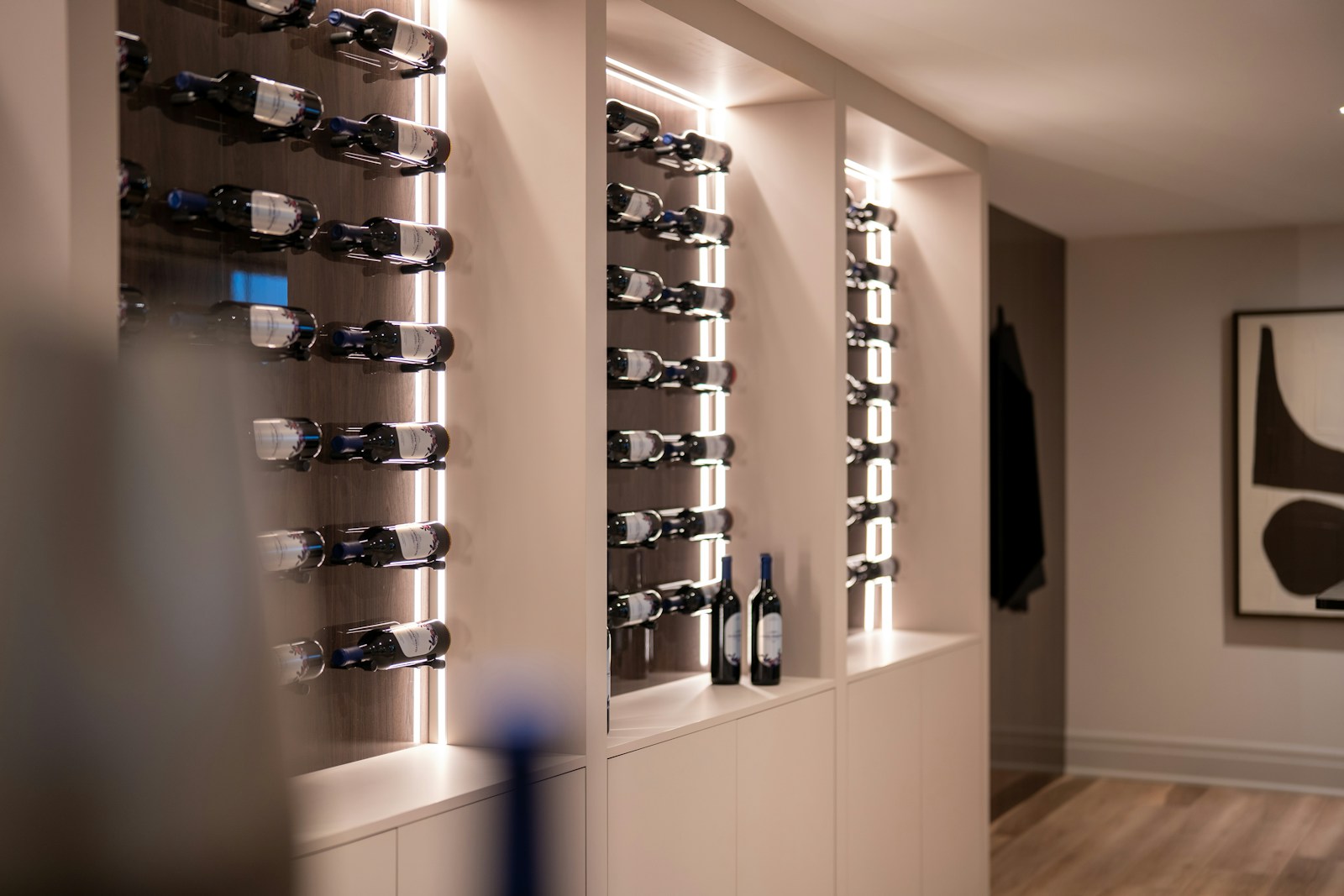 Liebherr illuminated wine cabinet wall with horizontal bottle racks — certified wine cabinet service